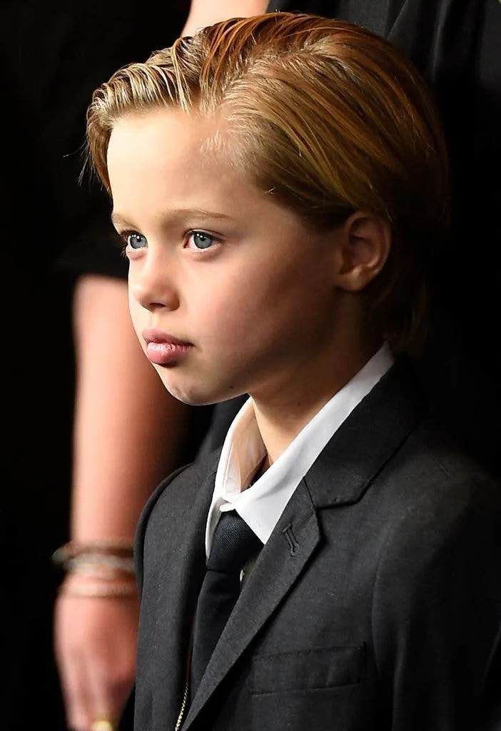 Shiloh Jolie-Pitt, daughter of Brad Pitt and Angelina Jolie, wears a suit and tie for the arrives for the U.S. premiere of Unbroken on December 15, 2014