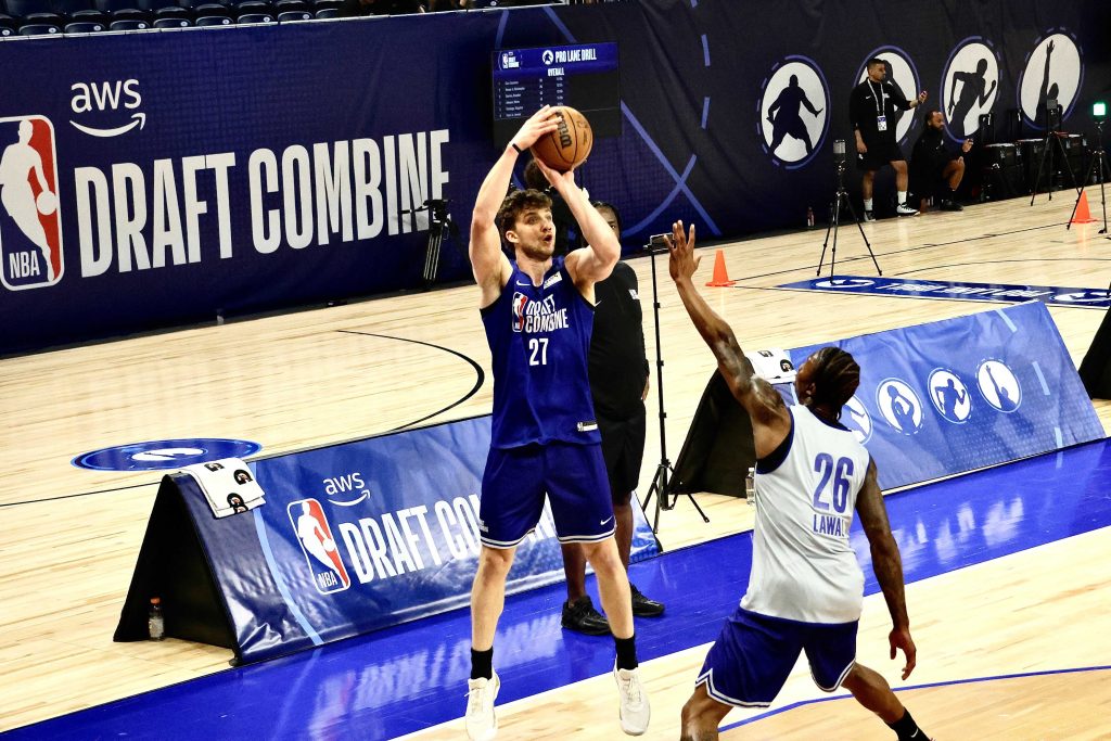 Northwestern forward Nick Martinelli launches a contested three-pointer against Virginia Tech forward Tobi Lawal during the scrimmage. (Kevin Lu/MEDILL) 