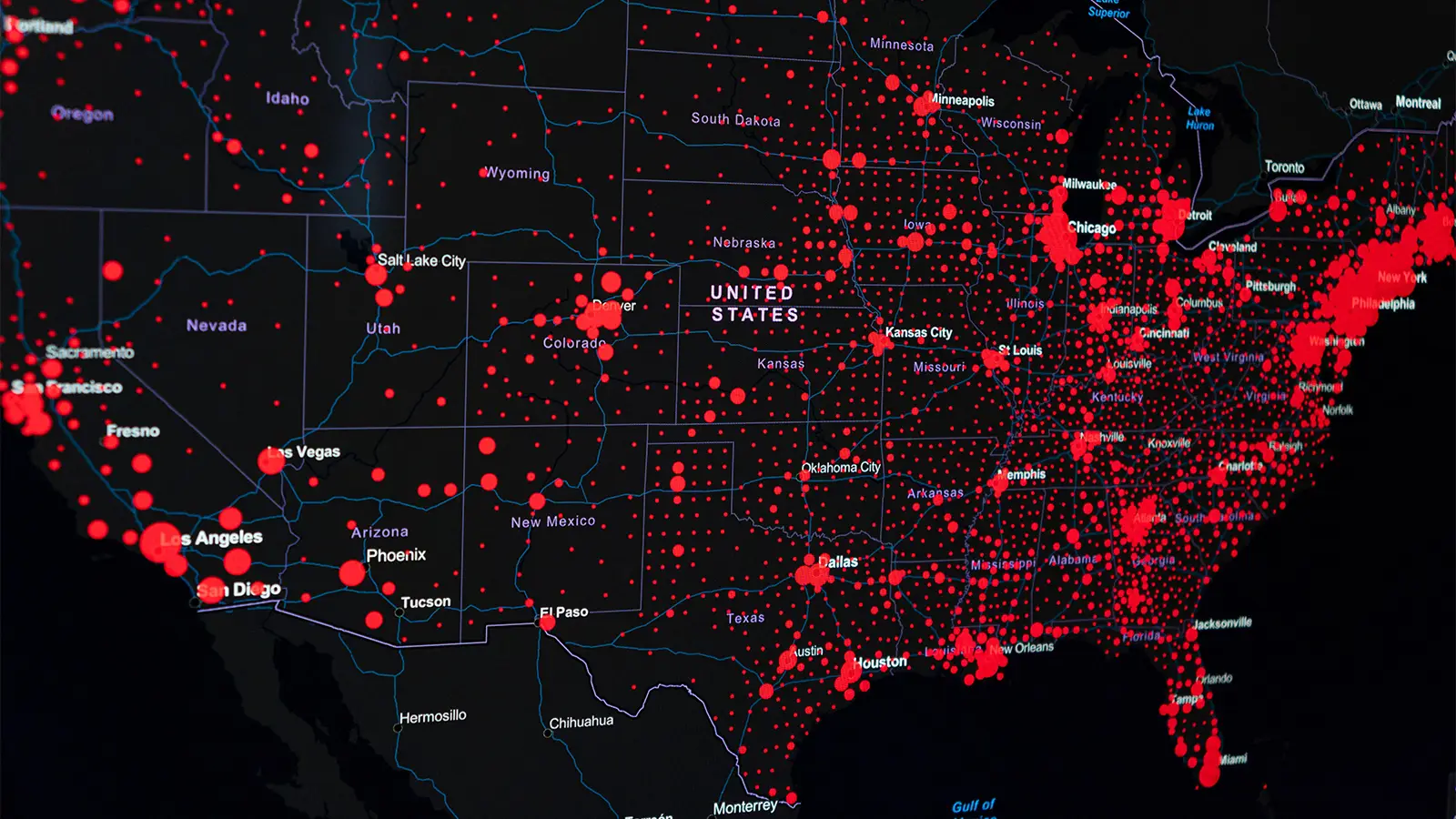A digital map of the U.S. with pandemic hotspots dotting the country.