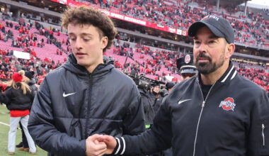 Nov 23, 2024; Columbus, Ohio, USA; Ohio State Buckeyes head coach Ryan Day celebrates with his son RJ Day (left) following the win against the Indiana Hoosiers at Ohio Stadium. Mandatory Credit: Joseph Maiorana-Imagn Images