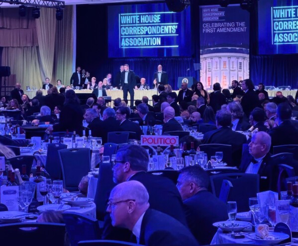 U.S. Secret Service agents respond near President Donald Trump and first lady Melania Trump during the White House Correspondents Dinner, Saturday, April 25, 2026, in Washington. (AP Photo/Alex Brandon, File)