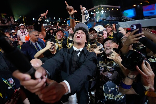 Arizona State wide receiver Jordyn Tyson celebrates with fans after being chosen by the New Orleans Saints with the eighth overall pick during the first round of the NFL football draft, Thursday, April 23, 2026, in Pittsburgh. (AP Photo/Sue Ogrocki, File)