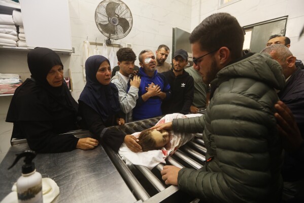 Palestinians mourn over Naya Al-Tanani, killed in an Israeli strike, at Al-Shifa Hospital in Gaza City, Saturday, April 25, 2026. (AP Photo/Yousef Alzanoun, File)