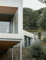 Wood Prefab Panels Cloaked in Galvanized Steel Form a Hillside Home in Barcelona - Photo 3 of 14 -