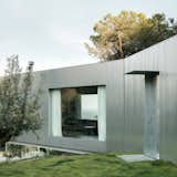 Wood Prefab Panels Cloaked in Galvanized Steel Form a Hillside Home in Barcelona - Photo 5 of 14 -