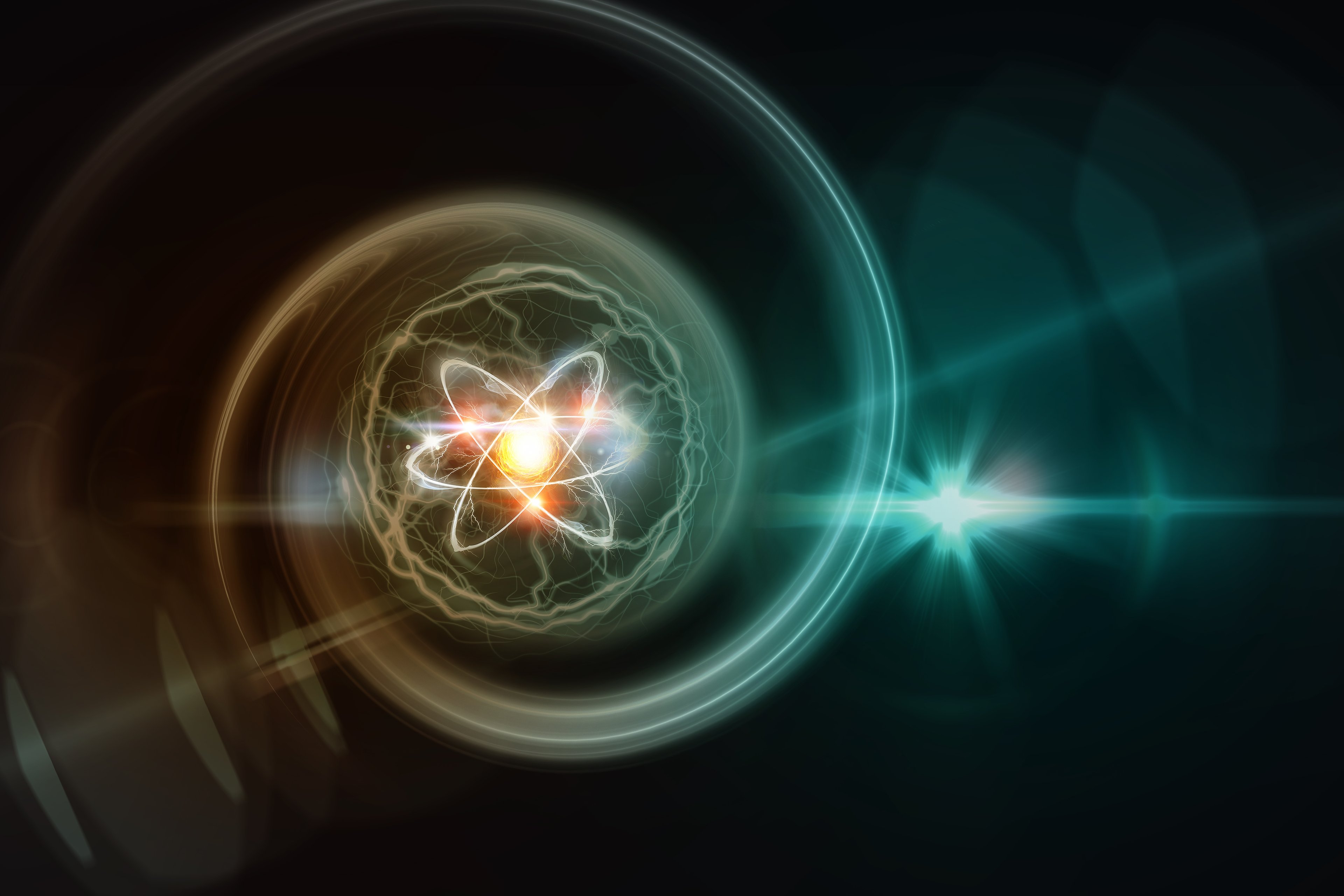 An artistic rendering shows an atomic structure against a dark background.
