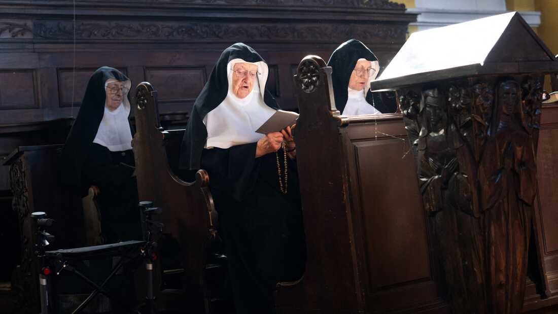 Sisters Rita (right), 81, Regina (left), 86, and Bernadette (center), 88, at the convent chapel of the Goldenstein castle south of Salzburg city, Austria on Sept. 20, 2025. Supporters of three nuns in their 80s flocked to the convent in a show of solidarity.