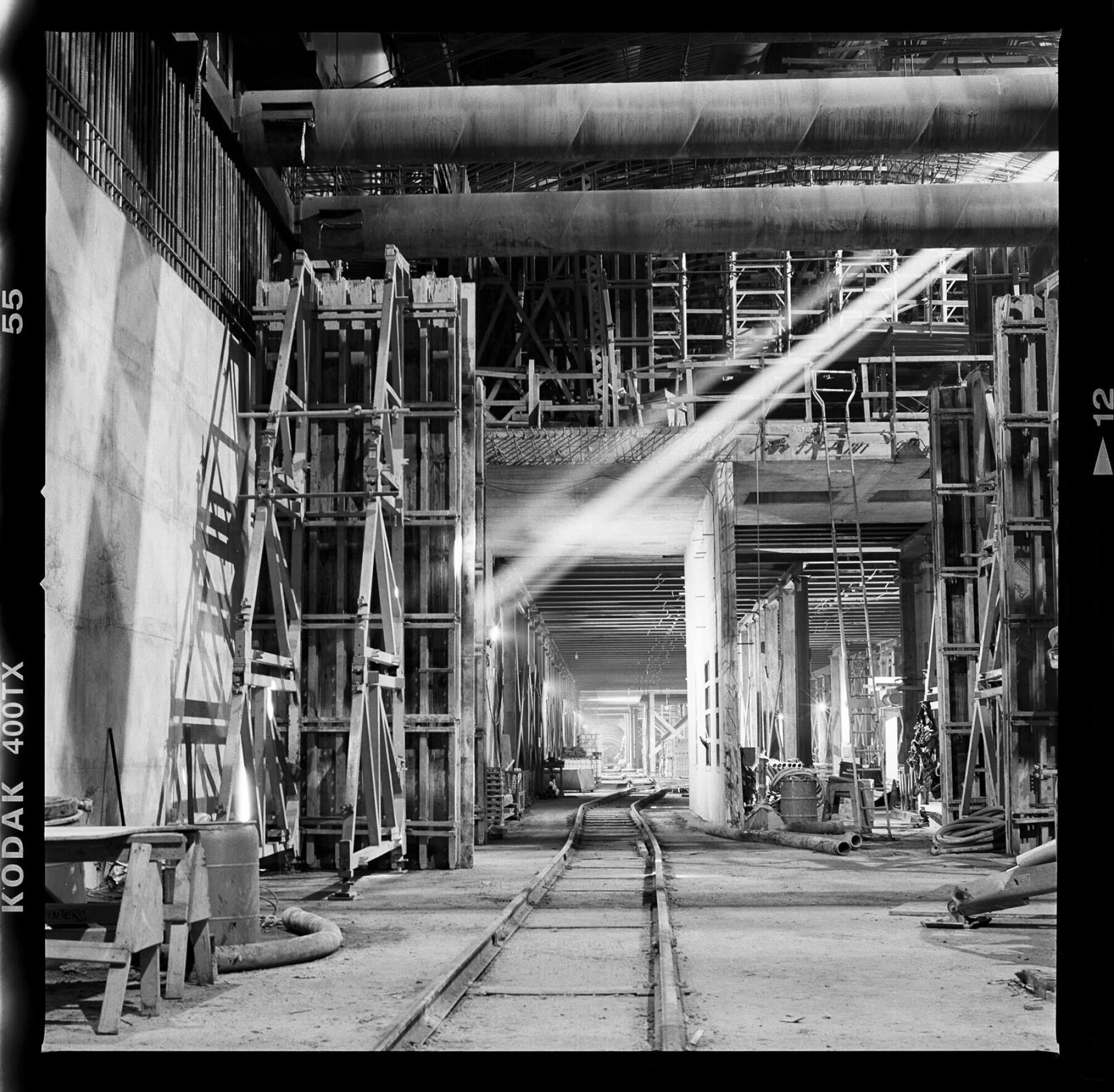 A photo by Karagozian shows sunlight filtering underground into the Wilshire/Fairfax site during construction.