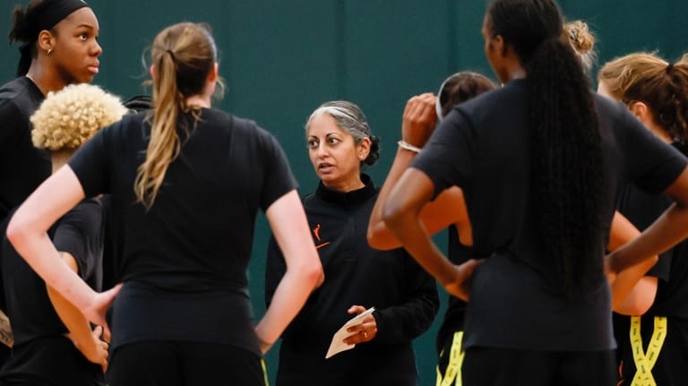 Seattle Storm head coach Sonia Raman speaks with her team...