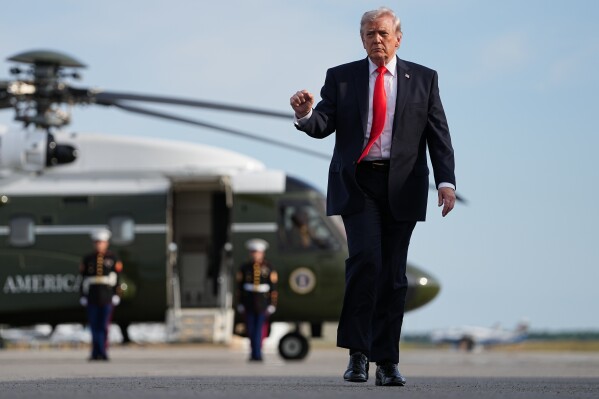 President Donald Trump walks from Marine One to board Air Force One at Ocala International Airport, in Ocala Fla., Friday, May 1, 2026, after speaking at an event in The Villages, Fla. (AP Photo/Matt Rourke)