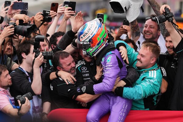 Mercedes driver Kimi Antonelli of Italy celebrates after winning the Miami Formula One Grand Prix auto race, Sunday, May 3, 2026, in Miami Gardens, Fla. (AP Photo/Rebecca Blackwell)