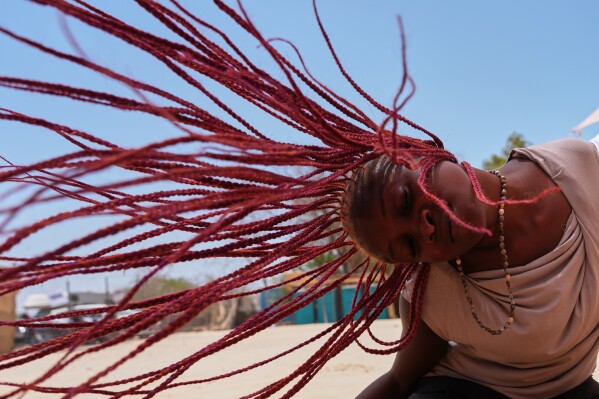 A lady attends a dance workshop at the Biennale of Dance in Africa, held at Ecole Des Sables in Toubab Dialaw, Senegal, Saturday, May 2, 2026. (AP Photo/Misper Apawu)