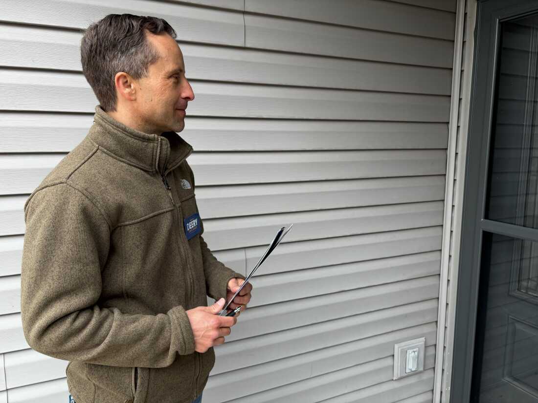 Indiana state Sen. Spencer Deery waits to speak to a voter as he goes door-to-door campaigning for re-election ahead of Indiana's primary where he faces a President Trump-backed challenger and millions spent to defeat him and other Republicans who voted against redistricting in the state.