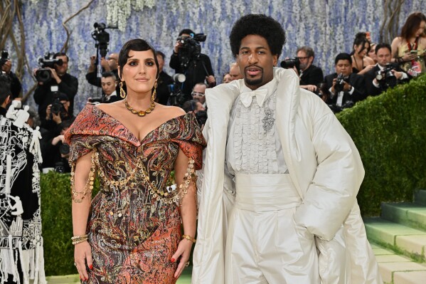 Jon Batiste, left, and Suleika Jaouad arrive at The Metropolitan Museum of Art's Costume Institute benefit gala celebrating the opening of the "Costume Art" exhibition on Monday, May 4, 2026, in New York. (Photo by Evan Agostini/Invision/AP)
