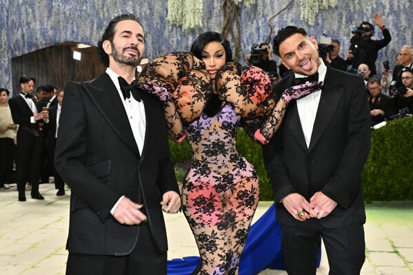 Marc Jacobs, from left, Cardi B and Char Defrancesco arrive at The Metropolitan Museum of Art's Costume Institute benefit gala celebrating the opening of the "Costume Art" exhibition on Monday, May 4, 2026, in New York. (Photo by Evan Agostini/Invision/AP)