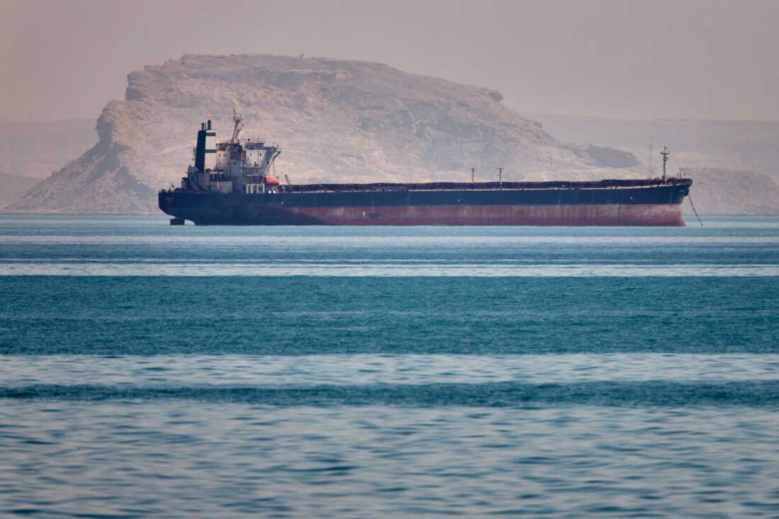 A bulk cargo ship sits at anchor in the Strait of Hormuz off Bandar Abbas, Iran, Saturday, May 2, 2026