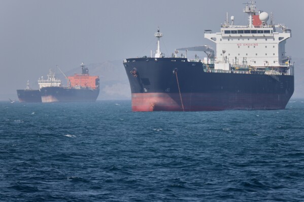 Oil tankers sit at anchor offshore in the Strait of Hormuz off Bandar Abbas, Iran, Saturday, May 2, 2026. (Amirhosein Khorgooi/ISNA via AP)