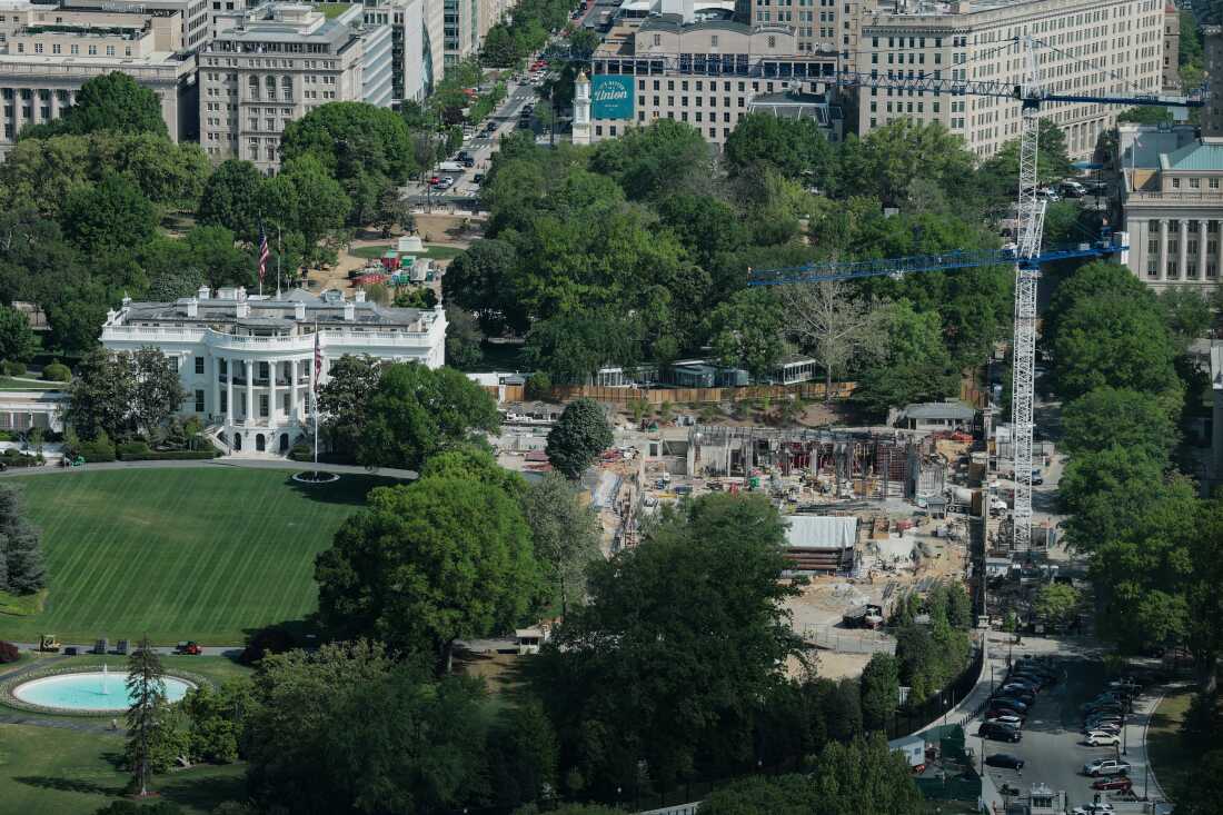 Construction cranes are seen, from the Washington Monument, on the site of the former East Wing of the White House on April 17, 2026 in Washington, DC.