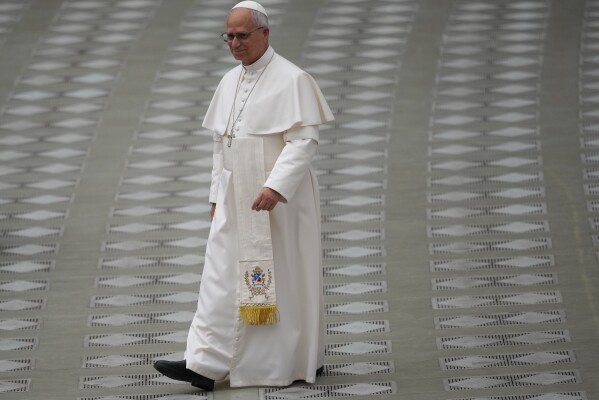 Pope Leo XIV arrives at the swearing in ceremony for 28 new Pontifical Swiss Guards in the Paul VI Hall at the Vatican, Wednesday, May 6, 2026. (AP Photo/Andrew Medichini)