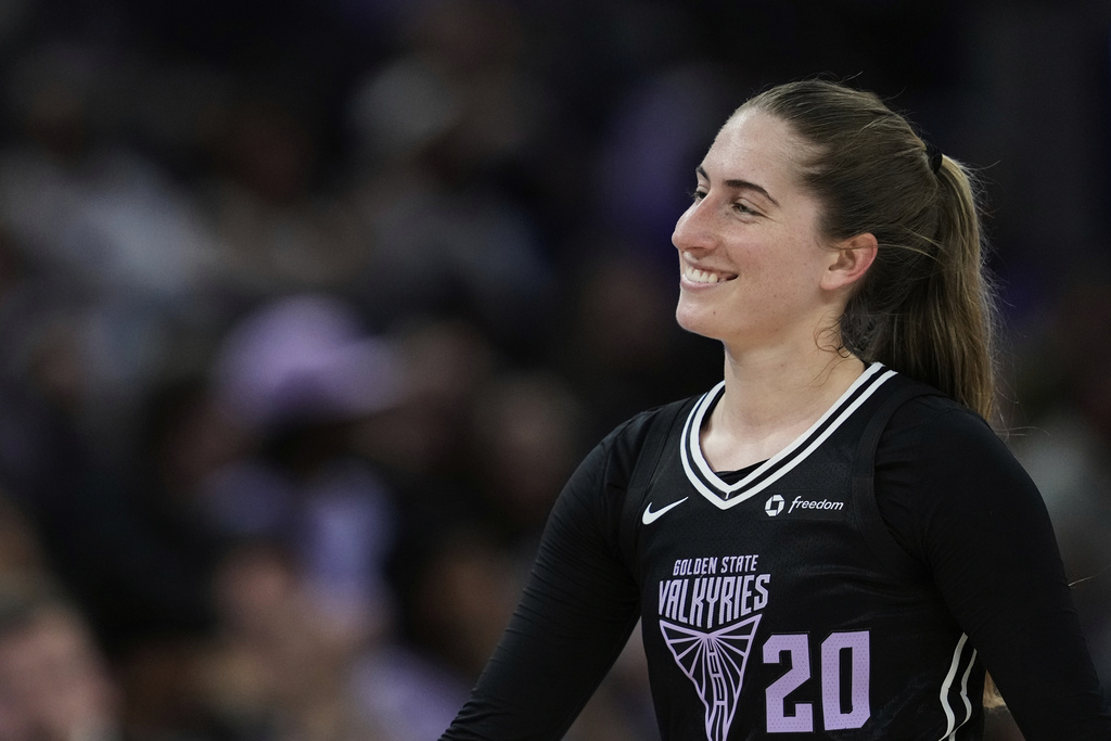 Golden State Valkyries guard Kate Martin smiles as she walks to the sideline during the second half of a WNBA basketball game against the Indiana Fever, Sunday, Aug. 31, 2025, in San Francisco. 