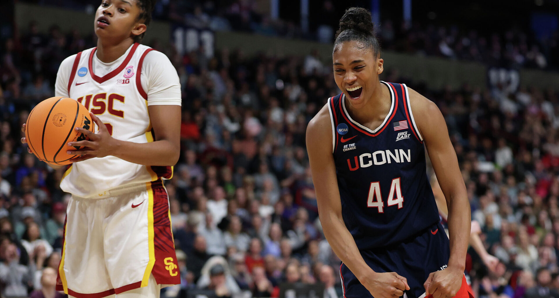 Aubrey Griffin #44 of the UConn Huskies reacts in front of Rayah Marshall #13 of the USC Trojans during the second half in the Elite Eight round of the NCAA Women's Basketball Tournament at Spokane Arena on March 31, 2025, in Spokane, Washington.