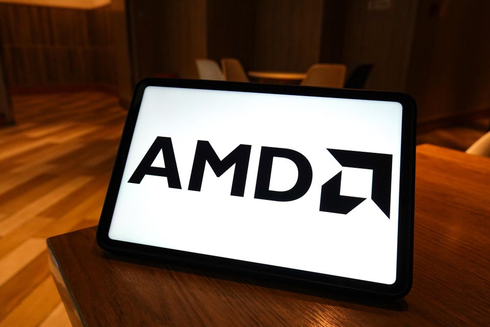 In this photo illustration, the AMD logo is displayed on the
