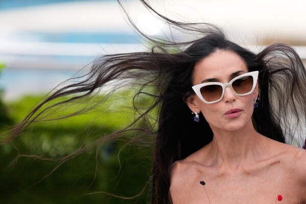 Jury member Demi Moore poses for photographers at the jury photo call at the 79th international film festival, Cannes, southern France, Tuesday, May 12, 2026. (AP Photo/John Locher)
