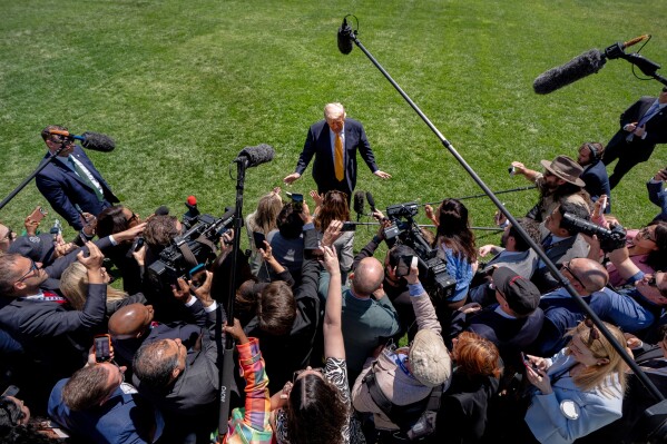 President Donald Trump speaks with reporters before departing the White House for a trip to Beijing, to meet with China's President Xi Jinping, Tuesday, May 12, 2026, in Washington. (AP Photo/Julia Demaree Nikhinson)