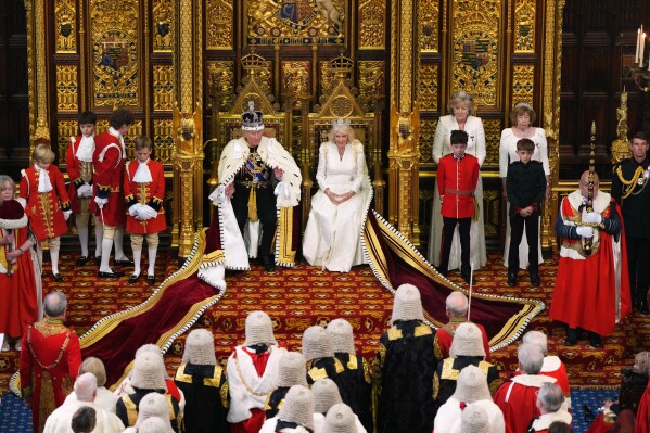 Britain's King Charles III sits besides Queen Camilla during the State Opening of Parliament at the Palace of Westminster in London, Wednesday, May 13, 2026.(AP Photo/Kirsty Wigglesworth, Pool)