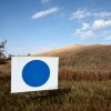 A 'Blue Dot' sign is viewed along the entrance to a farmhouse on Oct. 24, 2024 near Omaha, Neb.