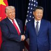 President Trump greets Chinese President Xi Jinping ahead of a bilateral meeting at Gimhae Air Base in Busan, South Korea, on Oct. 30, 2025. Trump heads to Beijing for another meeting with Xi