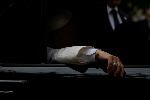 Pope Leo XIV leaves after visiting the Città Universitaria (University City) at Sapienza University of Rome, where he met with faculty and students at the institution's primary campus, one of the world's oldest and largest universities, Thursday, May 14, 2026. (AP Photo/Gregorio Borgia)