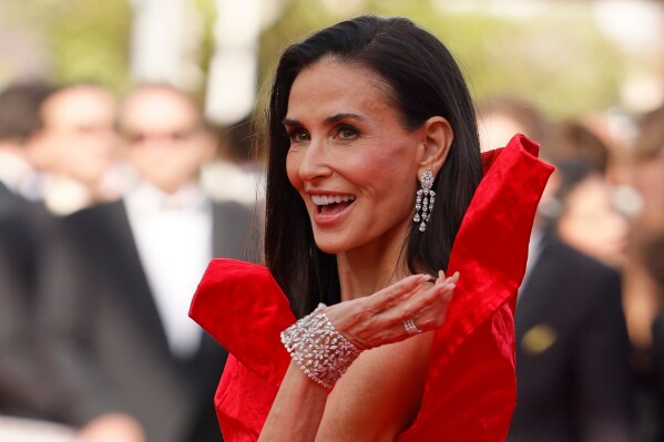 Jury member Demi Moore poses for photographers upon arrival at the premiere of the film 'Fatherland' at the 79th international film festival, Cannes, southern France, Thursday, May 14, 2026. (Photo by Millie Turner/Invision/AP)