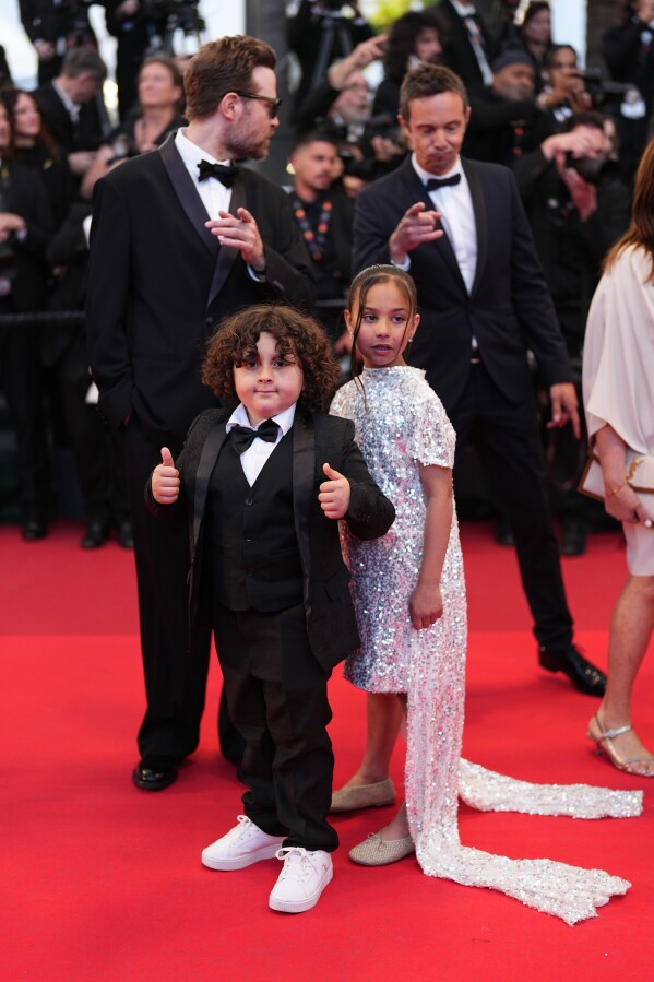 Aïdan Djouadi, left, and Ella Bedoucha pose for photographers upon arrival at the premiere of the film 'Parallel Tales' at the 79th international film festival, Cannes, southern France, Thursday, May 14, 2026. (Photo by Scott A Garfitt/Invision/AP)