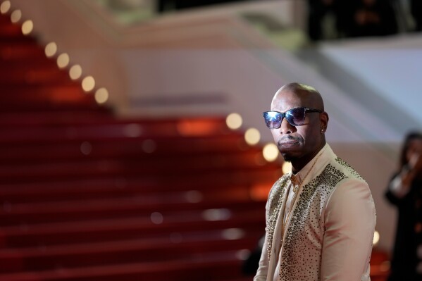 Tyrese Gibson poses for photographers upon arrival for the 25th anniversary of the film 'The Fast and the Furious' at the 79th international film festival, Cannes, southern France, Wednesday, May 13, 2026. (AP Photo/John Locher)