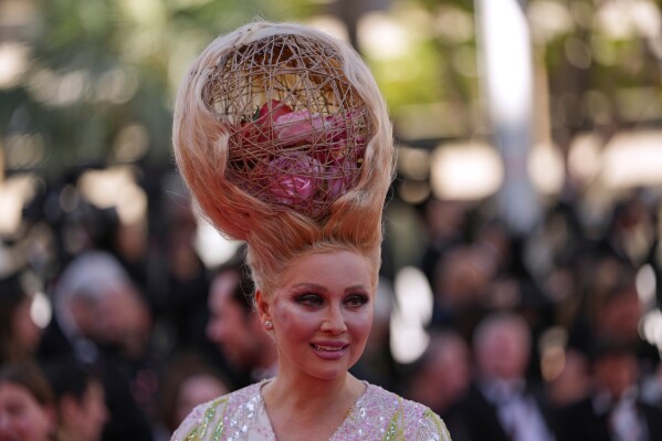 Elena Lenina poses for photographers upon arrival at the premiere of the film 'A Woman's Life' at the 79th international film festival, Cannes, southern France, Wednesday, May 13, 2026. (AP Photo/Andreea Alexandru)
