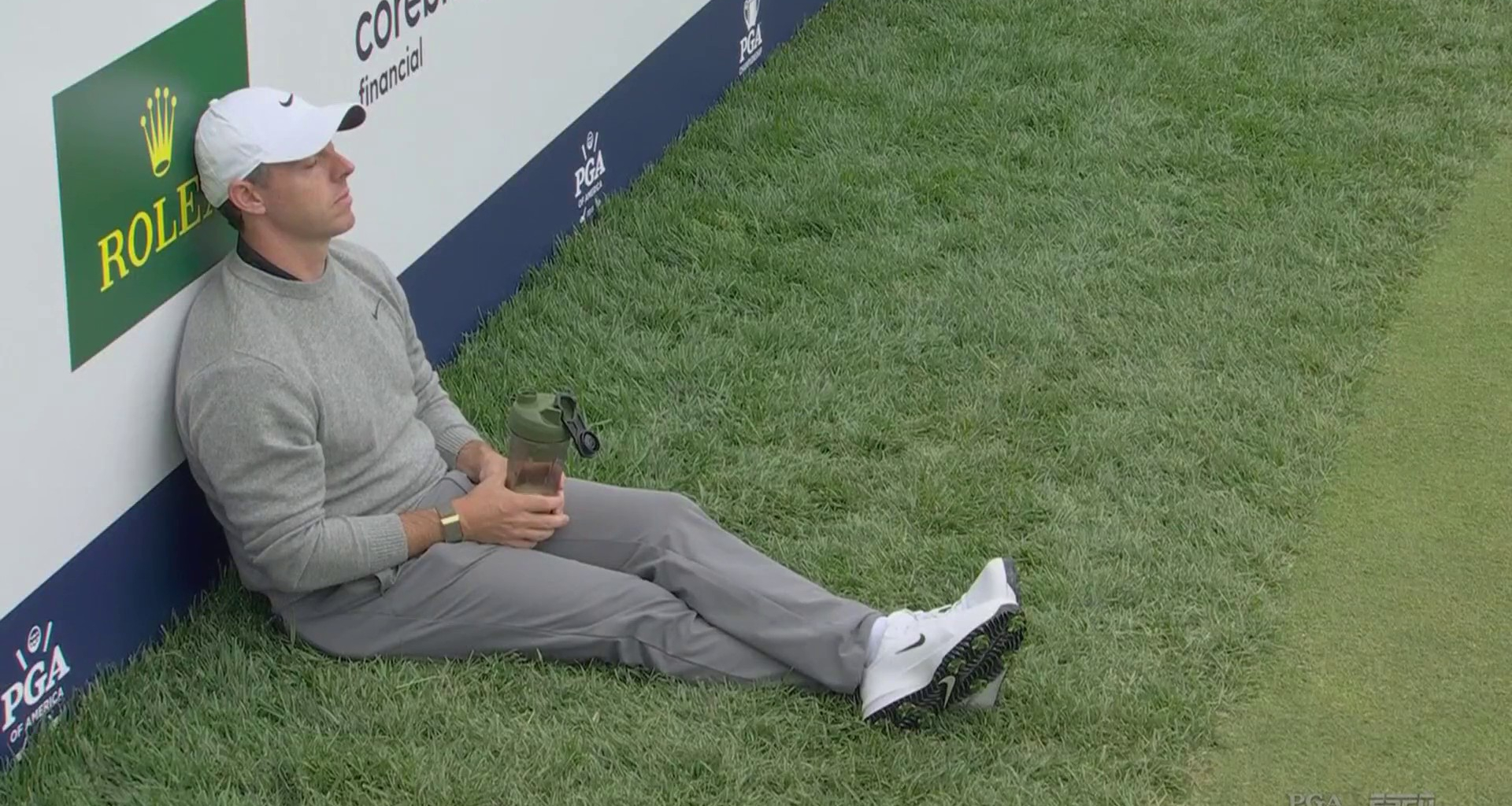 Glum Rory McIlroy slumps on grass at PGA Championship as rare vanishing golf ball causes chaos