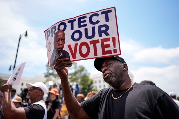 Aaron McGuire sings a spirtual song during a voting rally, Saturday, May 16, 2026, in Montgomery, Ala. (AP Photo/Mike Stewart)