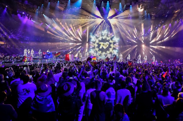 Performers on stage as voting results are collected during the Grand Final of the 70th Eurovision Song Contest in Vienna, Austria, Saturday, May 16, 2026. (AP Photo/Martin Meissner)