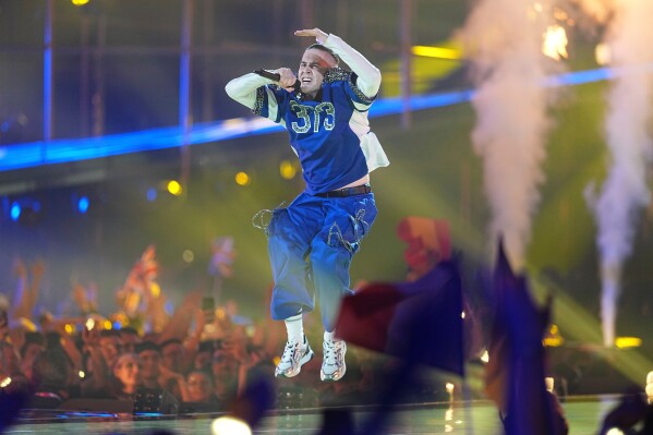 Satoshi from Moldova performs the song "Viva, Moldova!" during the Grand Final of the 70th Eurovision Song Contest in Vienna, Austria, Saturday, May 16, 2026. (AP Photo/Martin Meissner)