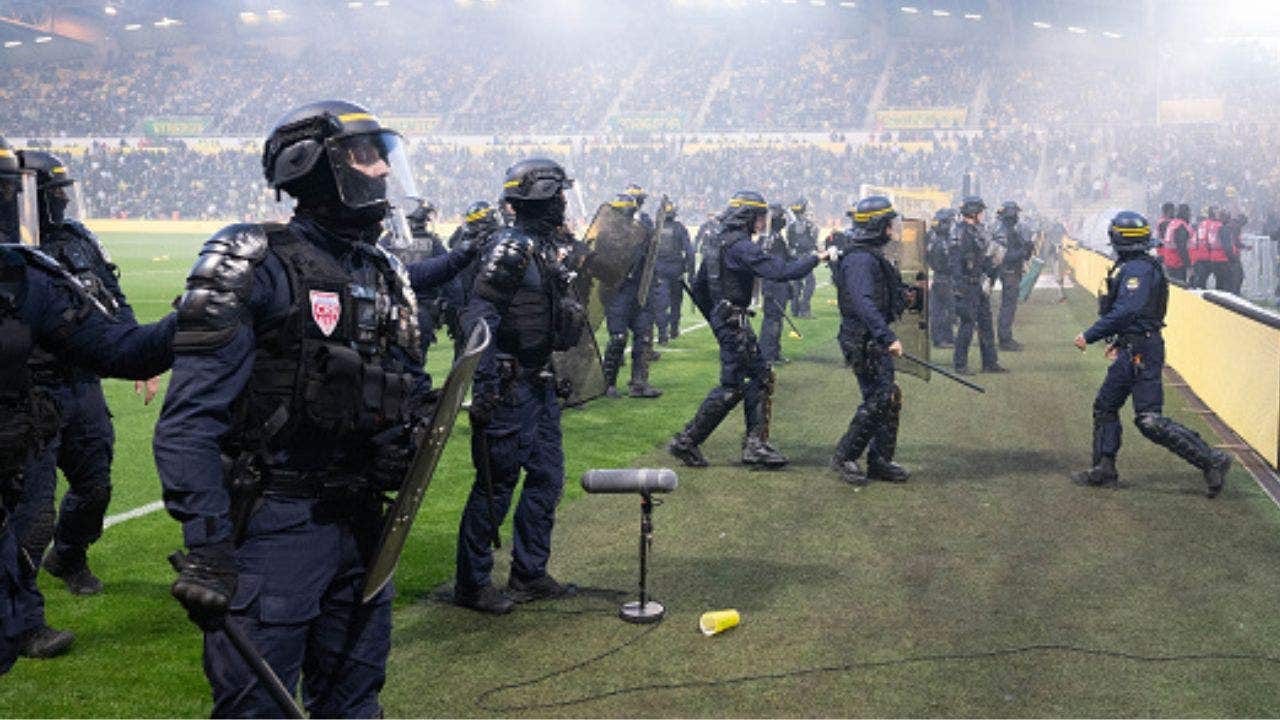 French football match descends into chaos as furious Nantes fans breach security, storm pitch