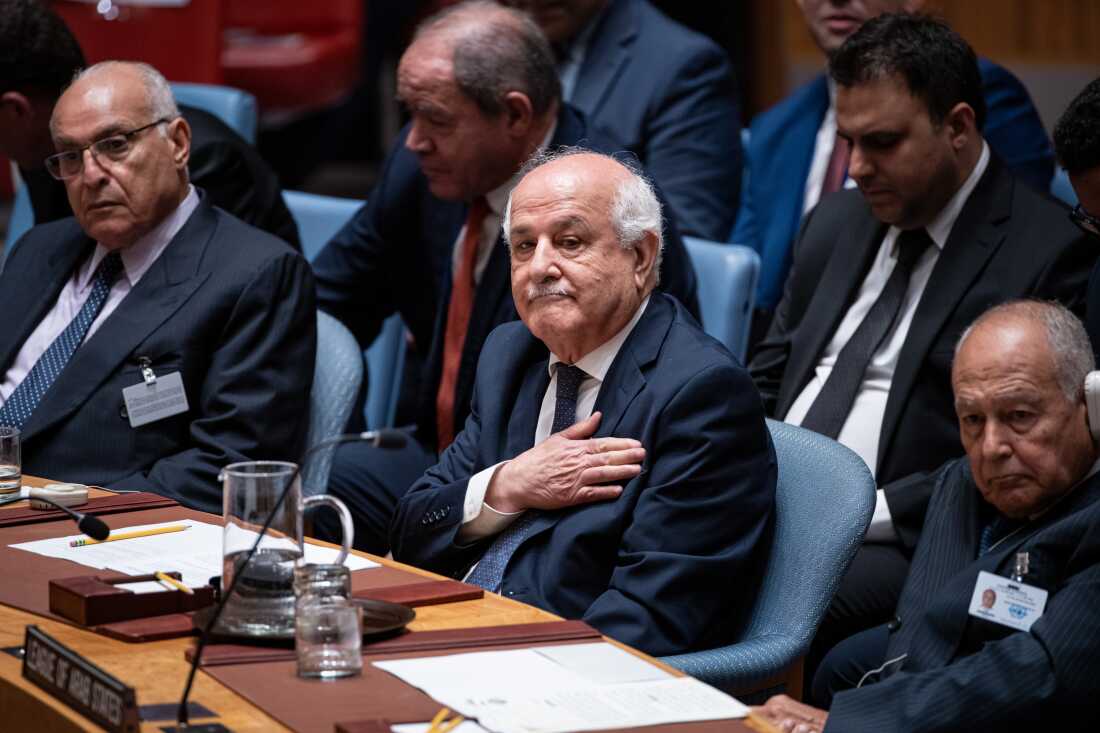 Palestinian Ambassador to the United Nations Riyad Mansour pats his heart during the Kuwait crown prince's address at the High-Level Security Council meeting on Palestinians and Israel during the 80th session of the United Nations General Assembly, Sept. 23, 2025.