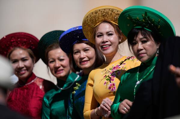 Vietnam's women wait weekly general audience with Pope Leo XIV, in St. Peter's Square, at the Vatican, Wednesday, May 20, 2026. (AP Photo/Alessandra Tarantino)