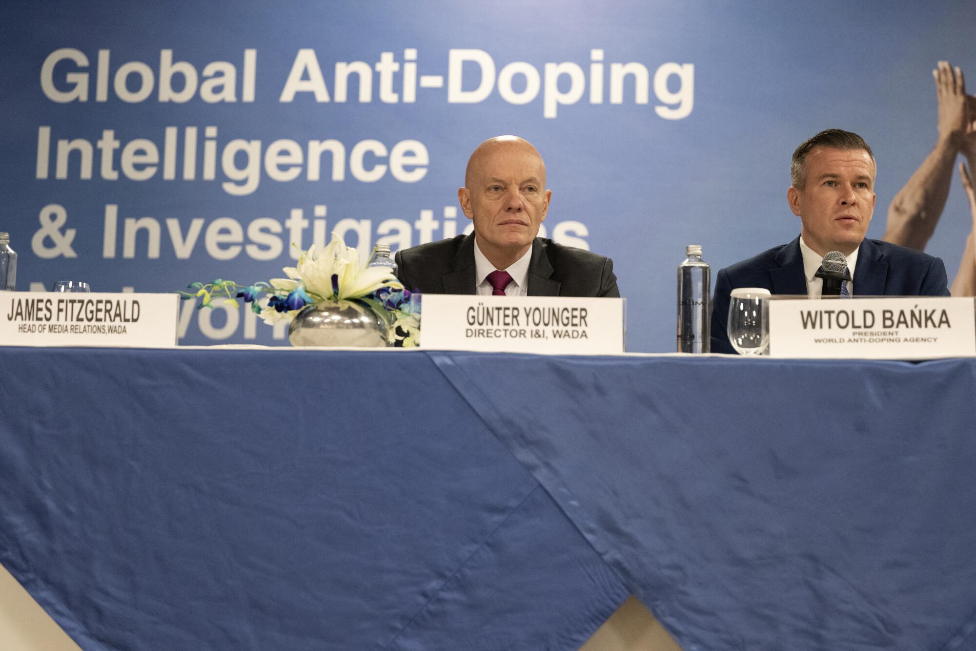 Two men address a news conference.