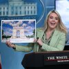 White House press secretary Karoline Leavitt shows a rendering of the planned triumphal arch to be added near Washington, D.C.'s National Mall as the Secretary of the Treasury, Scott Bessent, looks on at a meeting on Wednesday.