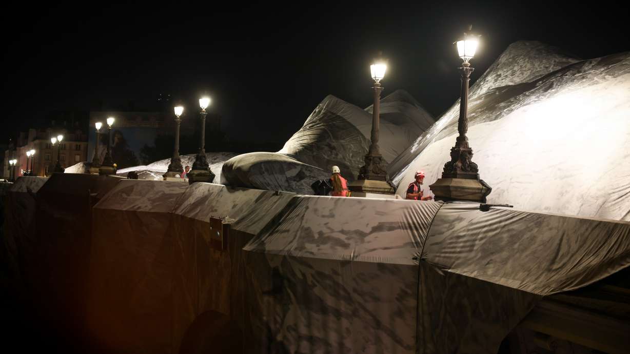 Artist JR, the 'French Banksy' creates a 'cave' installation over Paris' oldest bridge
