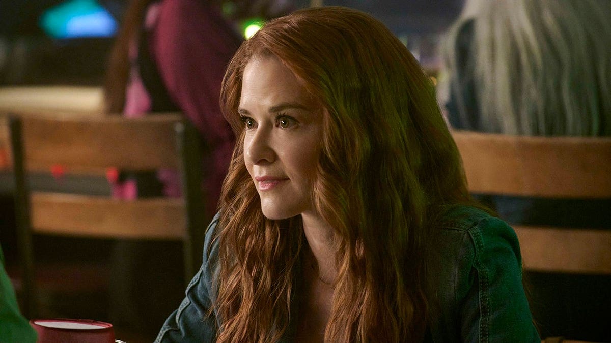 Sarah Drew poses for a portrait in a studio setting while filming "When I Say I Do" for Lifetime.