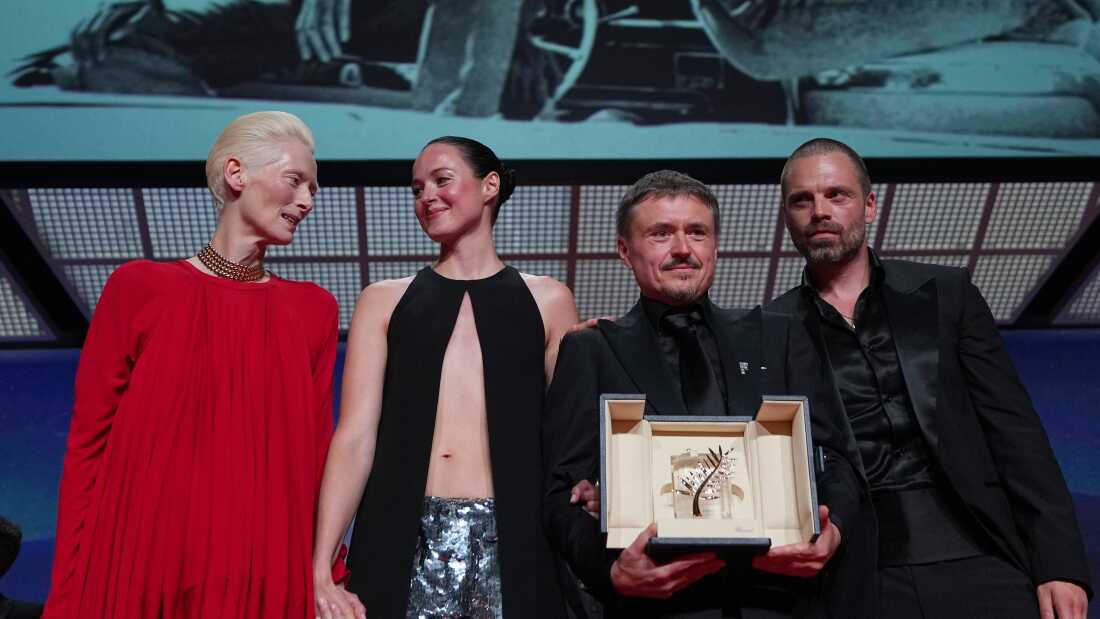 Tilda Swinton, left, poses with Renate Reinsve, Cristian Mungiu, winner of the Palme d'Or for 'Fjord' and Sebastian Stan during the awards ceremony at the 79th international film festival, Cannes, southern France, Saturday, May 23, 2026.
