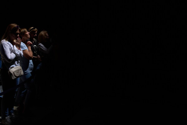 Faithful pray during a Pentecost Mass inside Rome's Pantheon, Sunday, May 24, 2026. (AP Photo/Alessandra Tarantino)