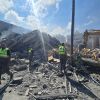 Lebanese civil defence workers search through the rubble of a building following an Israeli strike at dawn in the southern Lebanese area of al-Hosh, near the coastal city of Tyre on May 26, 2026.